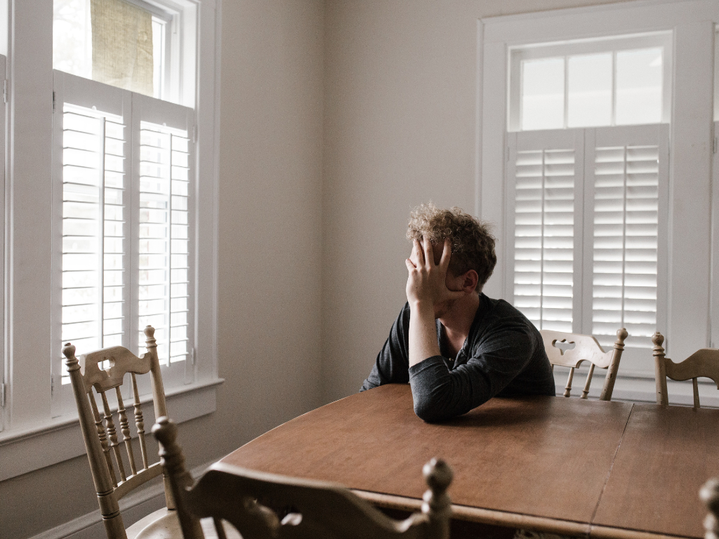 An image of a man lost in his thoughts