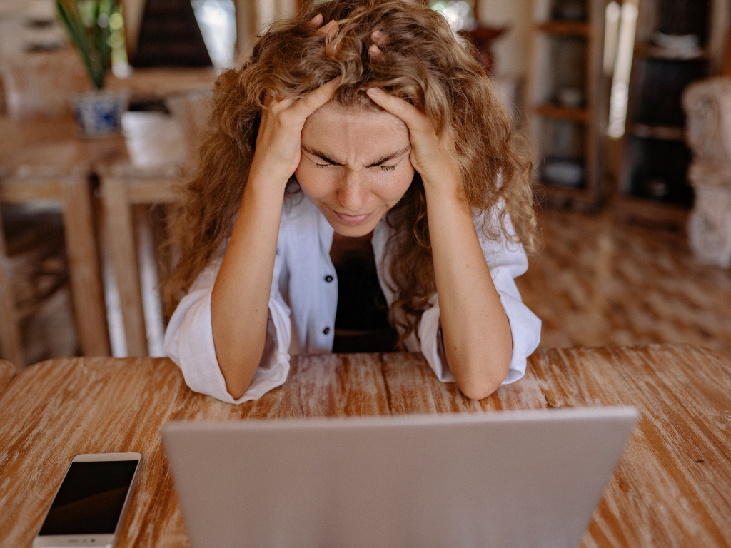 An image of a stressed out woman at work